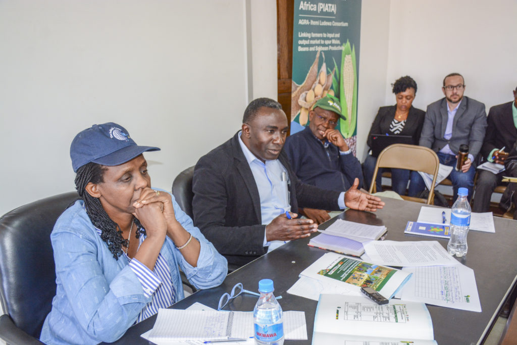 Mr. Wilfred Myuyu (in the middle), Iringa Region Acting Regional Administrative Secretary (RAS) addresses a workshop for sharing experiences about the green revolution in his area.  On his right is AGRA President Dr. Agnes Kalibata and on his left, is  Prof. Nuhu Hatibu, AGRA Regional Head for EAC.